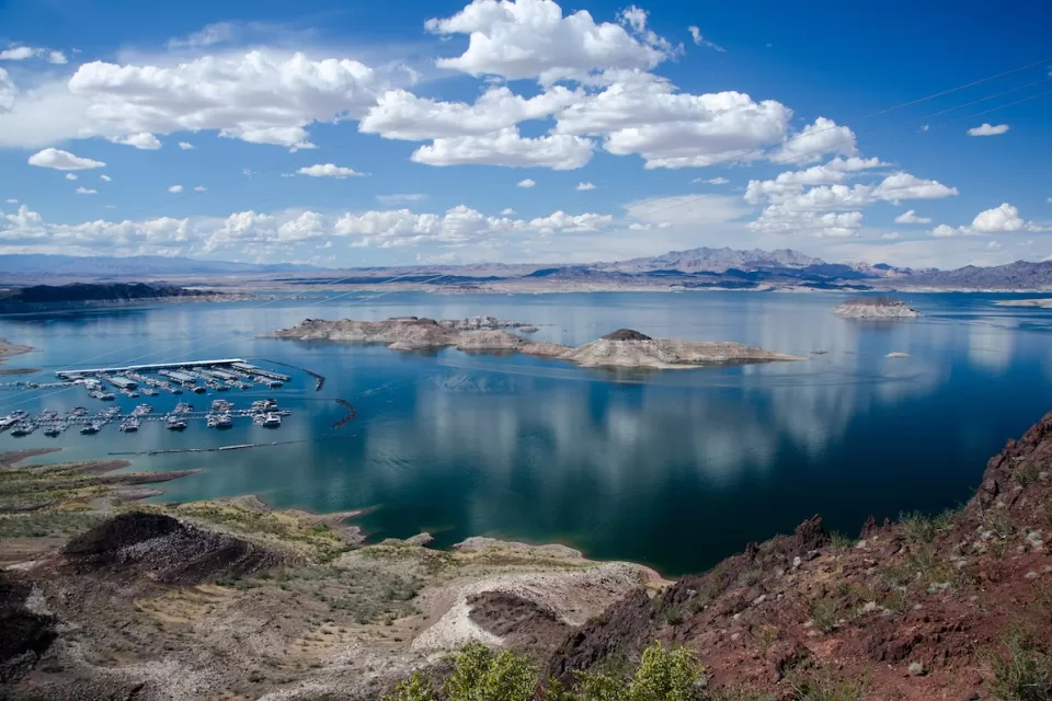 Lake Mead on the Colorado River with boats in a marina and clear low water line.